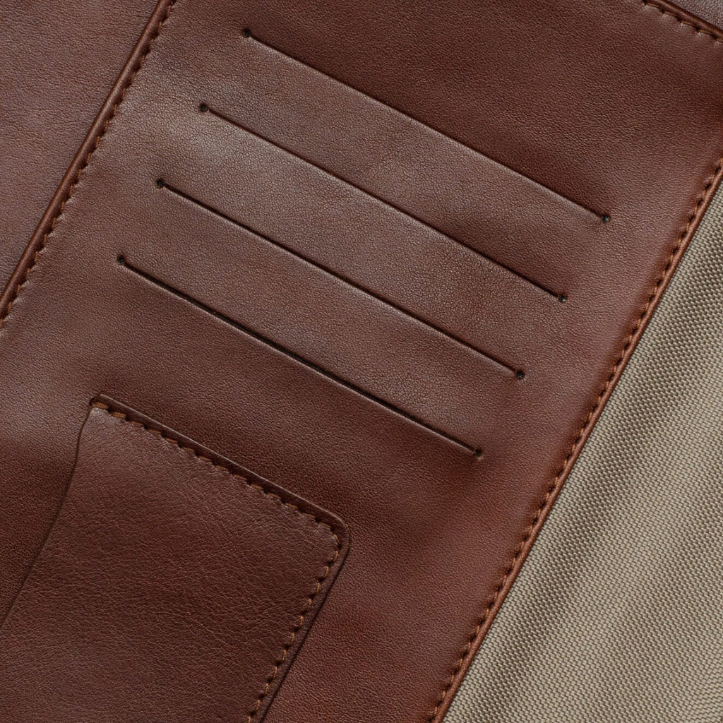 Close-up view of a brown leather portfolio with card slots